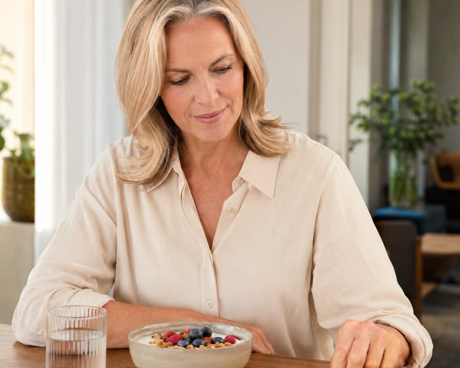 Woman combines a nutritious breakfast with her daily nutritional support